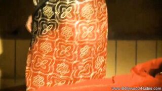 Watch India, the exotic Arabian MILF, tease and strip in a softcore striptease - 14 image