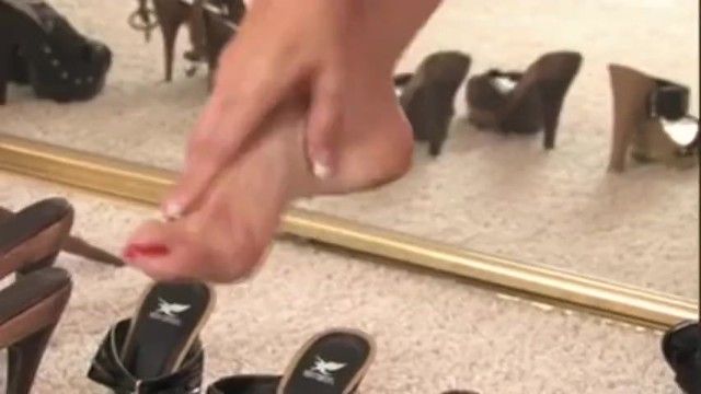 Glamorous milf showing off her hawt shoe collection and her foot fetish